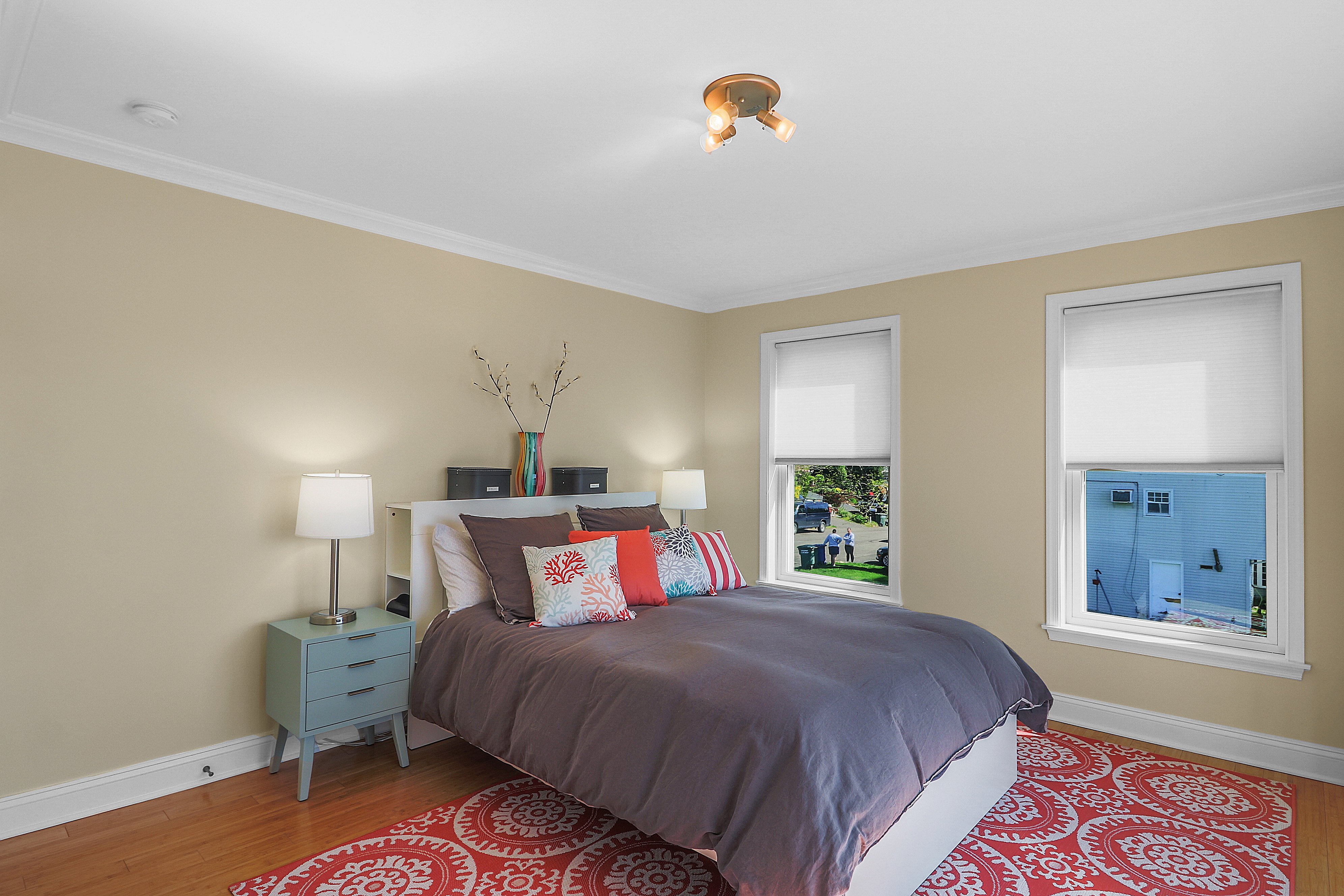 bedroom addition with red rug